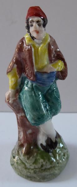 Porcelánová malá figurka arabského muže