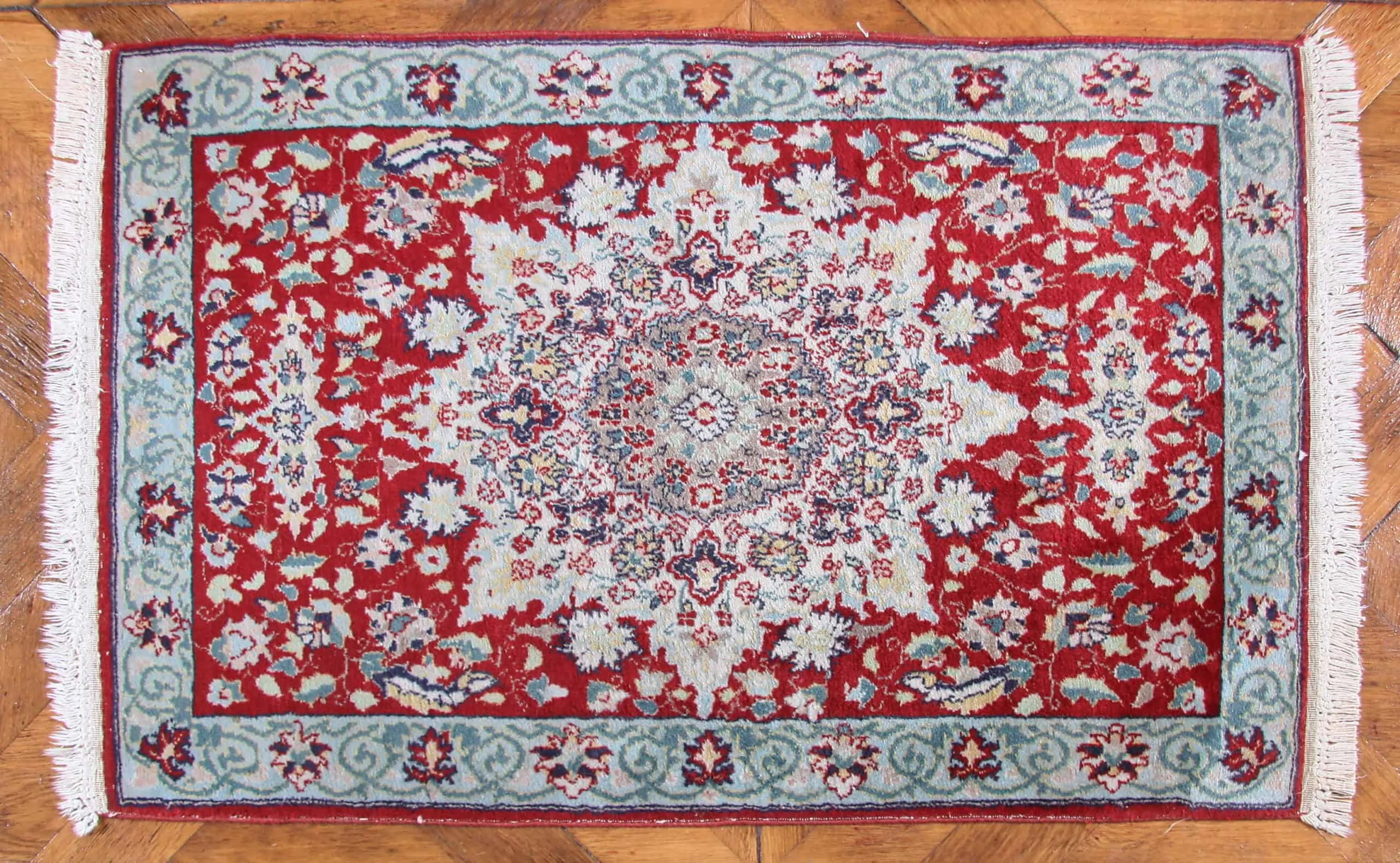 Ručně vázaná předložka z Mashadu 105 x 62 cm