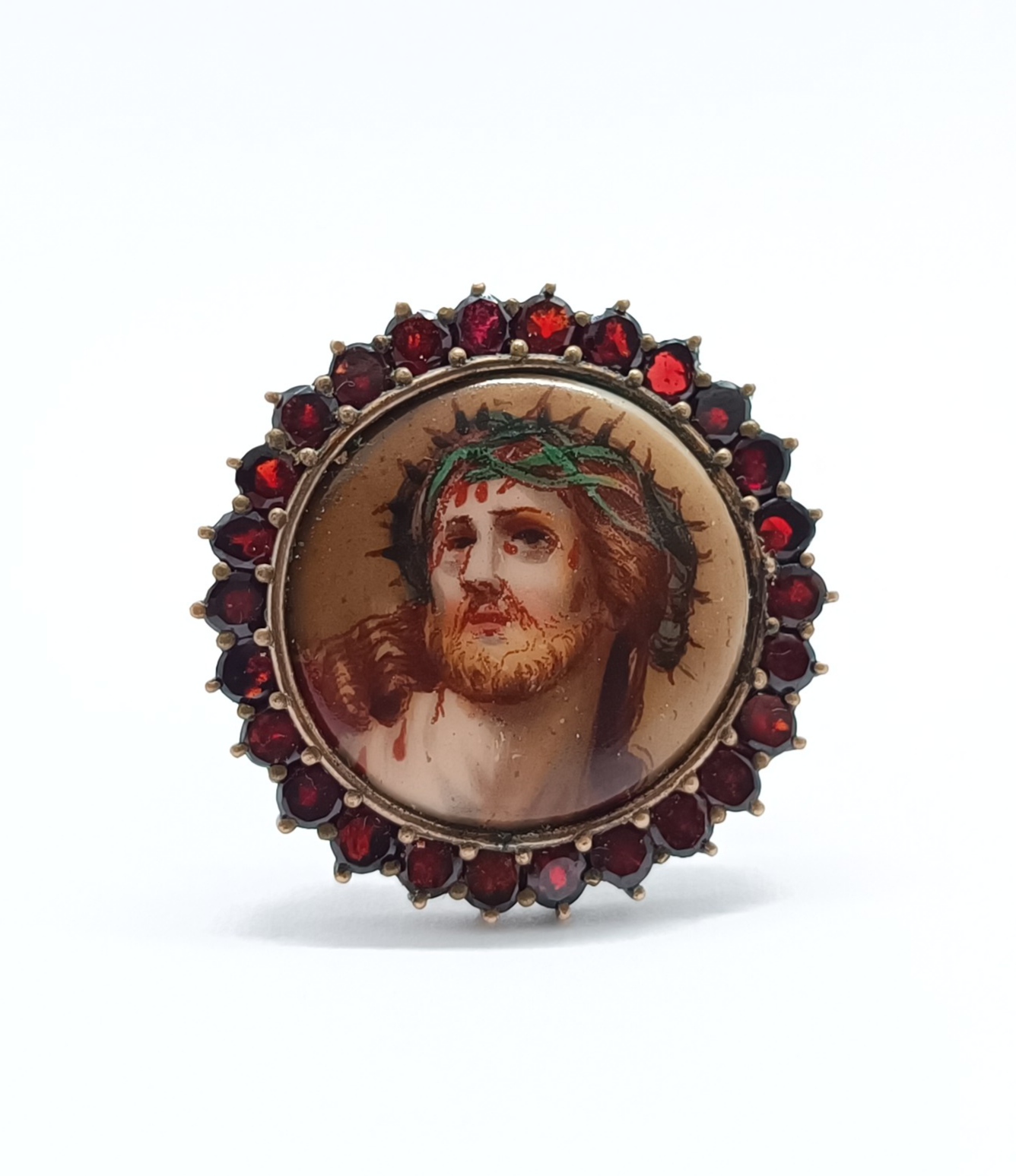 Granátová brož s portrétem Krista