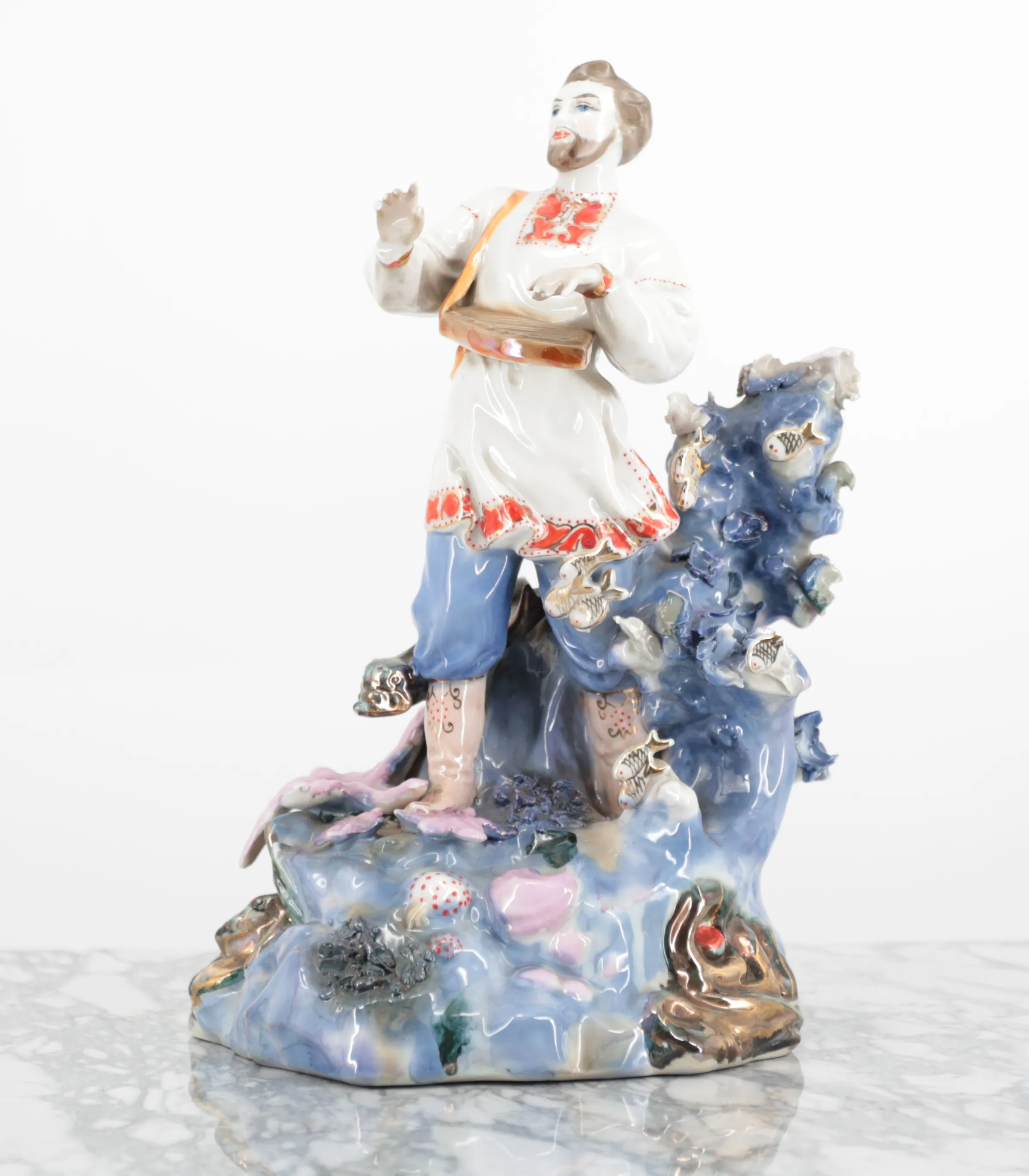 Ruská porcelánová socha hráče na citeru v 32 cm