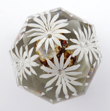 Malé těžítko se stylizovanými kopretinami